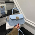 Sky blue crossbody bag with woven herringbone pattern and golden M logo detail - Blue