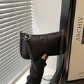 Minimalist black nylon baguette bag with silver triangular plaque and slim shoulder strap - Black