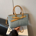 Chique Kelly handtas in blauw denim en bruin leer met een minimalistisch crossbody design - Blauw en Bruin