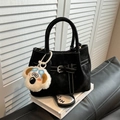 Black matte crossbody bag with contrast stitching and plush puppy pendant accessory - With Pendant / Black