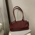 Deep red patent leather baguette shoulder bag with slim straps and side pleats - Red