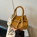 Caramel brown frosted bucket bag with white contrast stitching and plush bear charm accessory - With Pendant / Brown