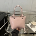 Sac seau rose minimaliste en cuir PU avec poignée nouée et bandoulière fine - Rose