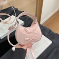 Pink crescent handbag with sweet bow accents and glossy finish for women - Pink