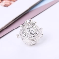 Detailed macro view of the silver filigree aromatherapy locket pendant with clear crystal - Silver - Pendant Only (Without Chain)