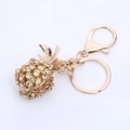 Detailed close-up of golden crystal pineapple keychain with sparkling yellow rhinestones - Key Ring Inner Diameter 2.3cm / Light Champagne