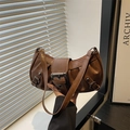 Vintage brown pleated hobo bag with metallic buckles and distressed aesthetic - Brown