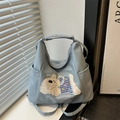 Bolso de mano azul claro en cuero sintético con bordado de perrito y correa ajustable - Azul