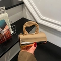 Golden mirrored cylindrical evening clutch bag with unique structured handle for women - Light gold