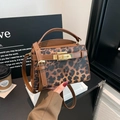 Luxury leopard print tote bag with brown leather handles and golden twist lock closure - Leopard Brown