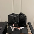 Minimalist black patent leather tote bag with glossy finish and silver hardware details - Black