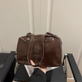 Polished dark brown leather Boston tote bag with metallic handles for women - Brown