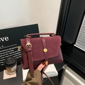 Retro burgundy leather shoulder bag with suede flap and gold metal snap button closure - Red