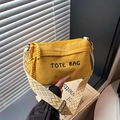 Yellow corduroy tote bag with embroidered text and colorful geometric shoulder strap - Yellow