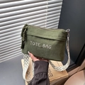 Dark green corduroy tote bag with embroidered logo and geometric patterned shoulder strap - Green