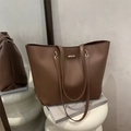 Minimalist large brown tote bag in smooth leather finish with golden hardware accents - Brown