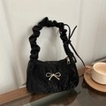 Chic black pleated underarm bag with gold bow accessory and scrunchie-style handle - Black