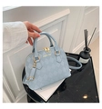 Light blue quilted shell handbag with gold hardware and adjustable shoulder strap - Blue
