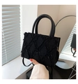 Fashionable black quilted handbag with unique fringe texture and elegant handle - Black