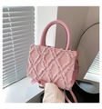 Pink quilted denim handbag with frayed tassel details and circular leather handles - Pink