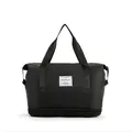Macro detail of black waterproof travel bag featuring a separate bottom shoe compartment - Black