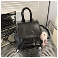 Mini black bucket backpack in PU leather featuring a drawstring and pink plush charm - Black With Rabbit Pendant