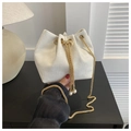 White corduroy drawstring bucket bag with gold chain strap and pearl charms - White