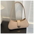 Close-up of beige faux leather shoulder bag featuring a silver heart-shaped metal buckle - Khaki