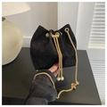 Black corduroy bucket bag with gold chain strap and elegant pearl drawstring charms - Black