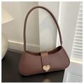 Detail view of a brown shoulder bag featuring a gold heart-shaped metal buckle clasp - Dark Brown