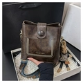 Dark brown vintage bucket bag with a wide geometric strap and rabbit charm detail - Coffee With Rabbit Pendant