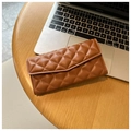 Elegant brown quilted long wallet for women with classic flap closure on a desk - Brown