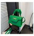 Close-up of bright green quilted handbag with gold bow lock and ruched handle - Green