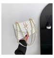 White quilted crossbody bag with gold chain strap and tassel detail for women - White