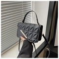 Quilted black leather handbag with gold metal clasp and versatile shoulder strap - Black