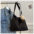 Minimalist large black canvas bucket tote bag with adjustable strap and plush charm - Black With Rabbit Pendant