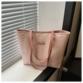 Detail of light pink quilted tote bag with wave texture and fashion logo on windowsill - Pink No Pendant
