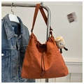 Caramel nylon drawstring bucket bag with a cute coffee cup plush charm on shoulder strap - Orange With Pendant