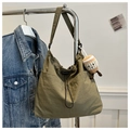 Large dark green tote bucket bag in nylon with drawstring and plush coffee charm - Green with Pendant