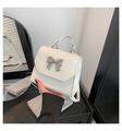 Elegant ivory white crossbody bag with a silver bow ornament and a top handle - White