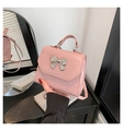 Pink PU leather handbag with silver metal bow accent and structured top handle - Pink