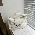 Elegant white faux leather underarm bag with a large pleated bow and silver metallic buckle - White
