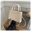 Beige woven straw handbag with white floral embroidery and gold metal accents - Off White