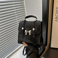 Elegante borsa a secchiello vintage nera con fiocco argento e manico superiore - Nero