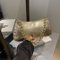 Chic metallic gold underarm bag featuring a chunky square chain strap and pleated texture - Gold