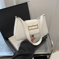White minimalist underarm bag with gold geometric clasp and wide shoulder strap - White