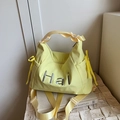 Light yellow nylon tote bag with Hai embroidery and adjustable shoulder strap for daily use - Yellow