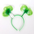 Green St. Patrick's Day headband with springy shamrock toppers and feather trim - Light Green Curly Furry Headband