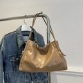 Minimalist khaki leather shoulder bag with NGONGZHU embossed lettering and drawstring detail - Khaki
