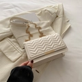Chic beige rectangular crossbody bag with V-quilted texture and gold chain strap - White
